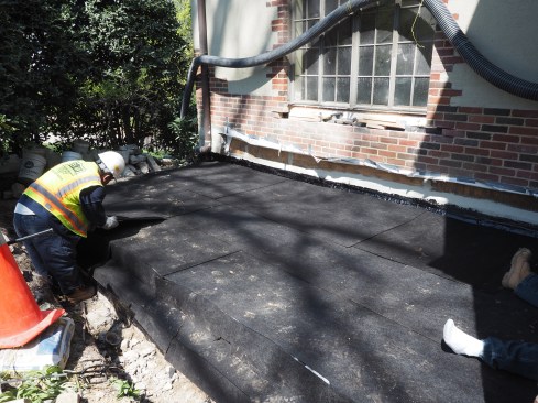 A course of protection board is laid over the waterproofing.
