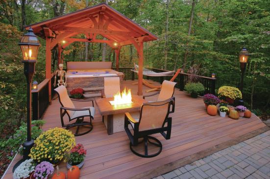 The homeowner requested a place to relax—and this 20x30 deck with hot tub, fire pit, and hammock has everything he needs to do it.
