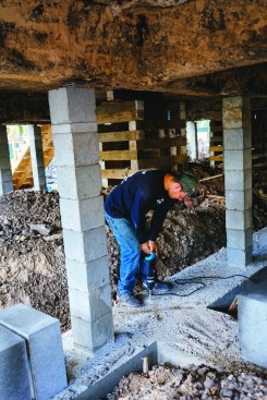 The rebar cage will be set into holes drilled into the newly poured grade beam.