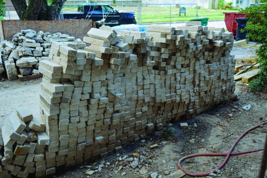 The crew used original matching brick salvaged from the home next door, which was demolished after the flood.