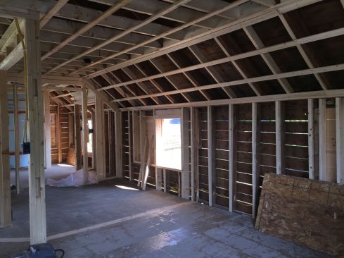 Inside the house, the second floor ceiling has been raised and the rafters and walls have been padded in to provide for increased insulation. The interior layout has been completey revised with new partition framing.