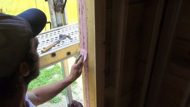 Tooling Joint and Seam Filler with a plastic trowel. (By the way, Joint and Seam Filler cleans up with soap and water, as JLC editor Ted Cushman learned when he got some on the seat of his wife's brand new Toyota Prius.)