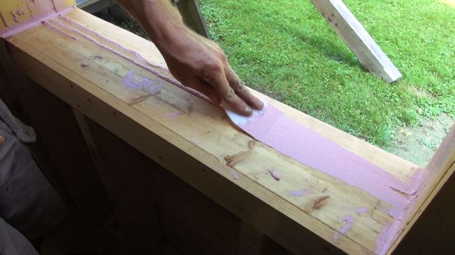 Tooling out the Joint and Seam Filler with a plastic trowel.