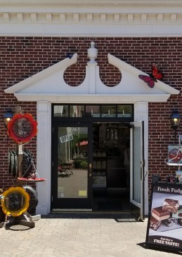 A poor attempt at a Georgian Colonial entry: Notice how the pediment is too wide, and how the oversized pediment dwarfs the columns, which look spindly by comparison.