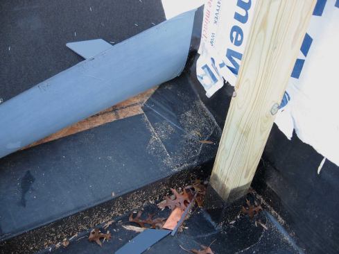 In the instance shown in photo, the installer left the release paper on to provide isolation. The problem with this detail is that I'm not sure what the life of that release paper is—certainly not as long as aluminum's—so this is a middle-road detail, maybe not best practice. But at least there won't be an immediate failure due to the incompatibility of the two membranes.