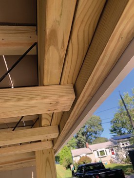Icon joists can be supported by inset beams as well as by dropped beams. Here, the author removed the squash blocks at the ends of the joists and replaced them with a two-ply 2x8 beam that spans across the support posts, followed by a third ply to strengthen the assembly.