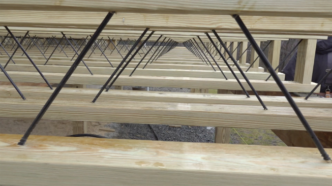 Blocking is required midspan and under bearing points but is easy to install because the open web of the joists (C) allows continuous blocking to be inserted from the side of the deck.