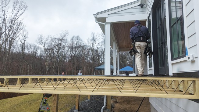Side rim boards that fit between the top and bottom chords of the edge joists can then be installed.
