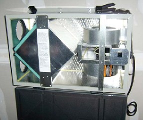 An energy recovery ventilator (ERV) provides whole-house ventilation while capturing heat held in humid indoor air and transferring it to the incoming fresh air.