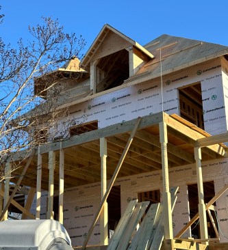 On the building’s north side, threaded steel rods extend above the header in preparation for installation of the second story porch posts adjacent to Queen of Zero’s primary bedroom suite.