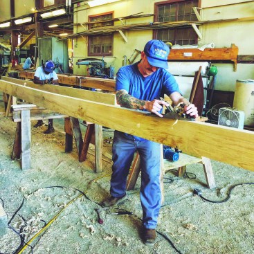 Anthony Matt hand-planing a plank