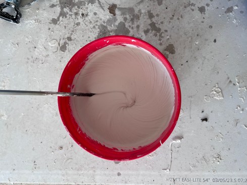 After mixing in about 1/2 cup of water, she gets a nice, smooth consistency that is vastly easier to work with.