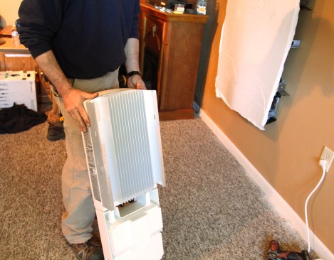 The upper part of the inverter (where it converts DC to AC) has a large, heat-sink plate on the back of the unit. The bottom of portion acts as a communications hub.