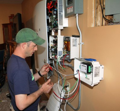 Millette begins wiring the smart meter by connecting the three-conductor, light-gauge RS485 communication circuit. The StorEdge meter handles communication with the utility and facilitates real-time remote control of the system.