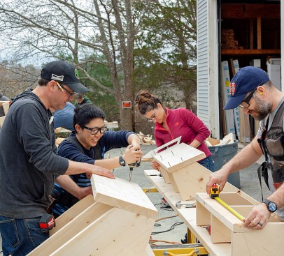 Carpenter Aaron Butt (@aaronthomasaquinas) leads a stair-building workshop at Grand Banks Building Products in Gloucester, Mass.—one example of the new Chautauqua that, with the help of social media, is attracting young carpenters. (Photo: Monica Banks)
