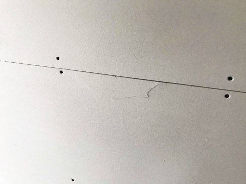Broken edges need to be repaired (the broken area cut out and the void prefilled with a setting compound) before taping and finishing the seam.