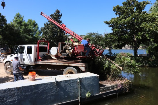 The first step to installing the steel piles was to drill holes about 10 feet deep, using a rig with a much smaller diameter bore than we needed for the pier holes on the SIPs house.