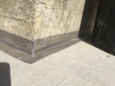 The posts were needed structurally to support the floor girder, but it created a cold joint in the concrete that needed to be protected with Termimesh.
