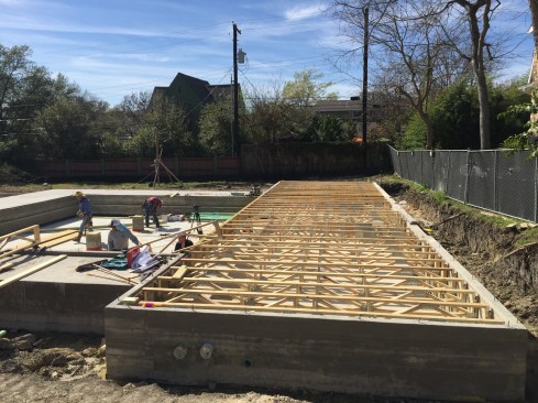 We formed a perimeter beam that both supported the slab edges and acted as a stem wall, rising above the slab floor to create a crawlspace.
