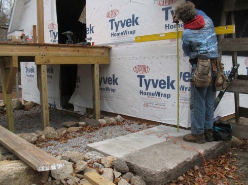 The layout starts the same as when marking out for cut stringers with determining the overall height from top of finish deck to grade landing at the point where the bottom step will fall. 