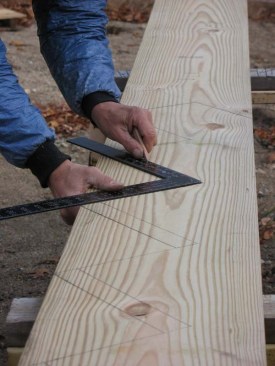 After the primary stringer layout I make a second pass to scribe the bottom lines for the treads using the 1 1/2 in. tongue of a framing square.  This lower line is where the top of the tread brackets will align to.