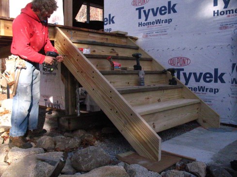 Five inch flat head structural screws are driven through the stringers and into the treads and risers.
