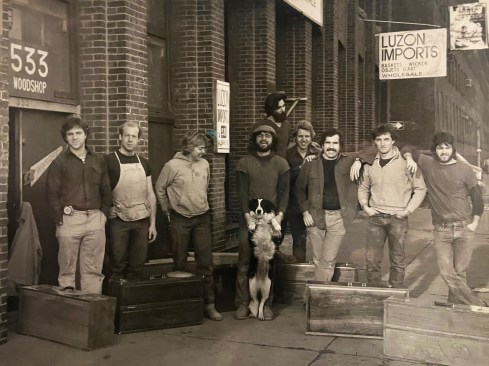 Outside Dixon Bros. Woodworking, circa1976. Jed stands in the center with Sam, the shop dog.
