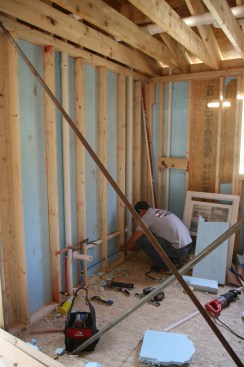 3:58p A plumber roughs in the kitchen