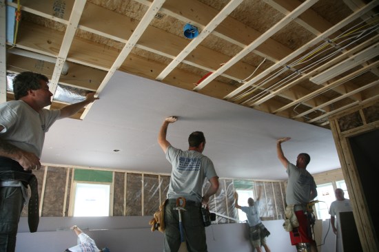 1:12p Rough inspection done, walls insulated, and the board hangers are off and running.