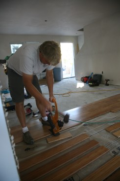 7:23a Day 3 Prefinished bamboo flooring goes down in the kitchen/living room.