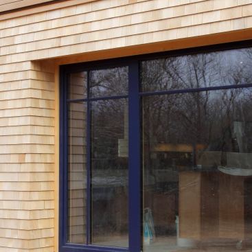 Locating a window away from the outside of the wall requires exterior jamb extensions made from either the trim material or exterior siding.