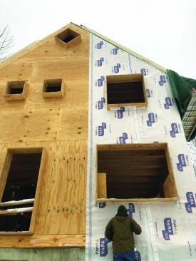 In this example, the homeowners chose a superinsulated wall system with an exterior insulation curtain composed of 10-inch wood I-joists filled with dense-blown cellulose insulation.