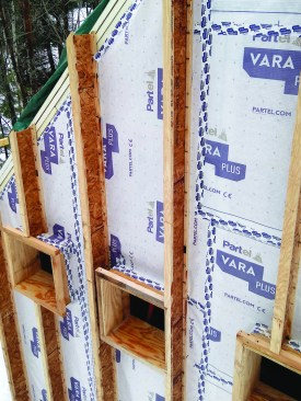 A smart vapor and air control membrane was located in the center of the wall between the interior stud frame and the exterior I-joist build-out.