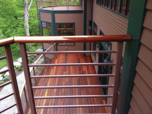 For handrails, doors, and vertical surfaces, the author prefers to use marine-grade spar varnish rather than an oil finish.