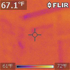 The wall in the previous photo is shown here on the infrared camera. A flaw in the narrow corner stud bay is clearly visible as a cold (dark) spot.