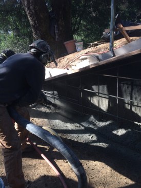 Shotcrete contractor Oscar Duckworth applied concrete to the reinforced form.