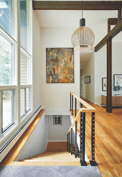 At the entry, a heavy oak banister was replaced with cable railing, which echoed the railing used on all exterior decks as well.