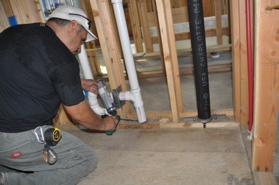 Before drywall, all plumbing and electrical pentrations in walls are sealed with expanding foam to stop air flowing between the lower floors and the attic.