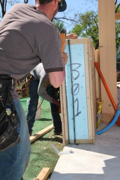 Reaching the tightest air sealing standards (below 1 ACH50) starts at the earliest framing stages. Here, the author’s crew is installing a Bensonwood home, which includes a double bulb gasket between SIP wall panels.