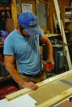 The author uses a cardboard template made at the jobsite to guide his placement of 1x4 forms.