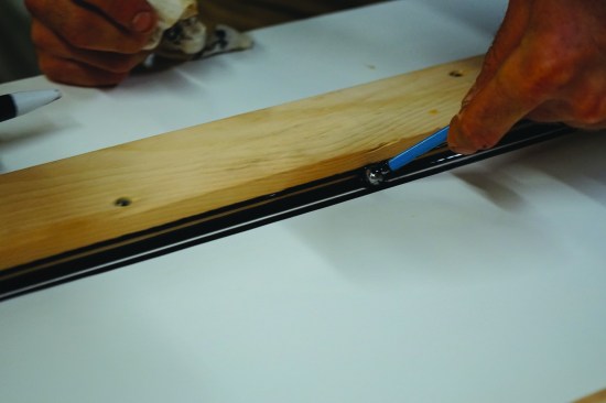 Tooling the caulk with a stainless steel ball used by cake decorators creates a consistent, smooth eased edge on what will be the upper face of the windowsill.