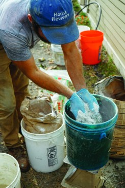 He pre-mixes the cement and dry admixtures.