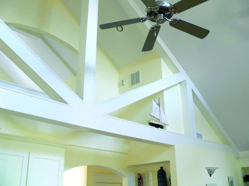 An always-on air-mixing fan pushes the dried air down to a basement stairwell register.
