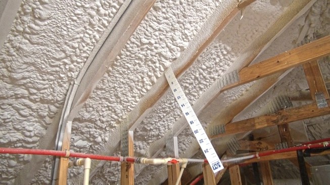 A preapplied paper ruler helps foam installers and inspectors verify application thickness.