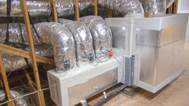 In this high-end system in an insulated attic, three zone supply ducts coming out of a distribution box are equipped with motor-controlled dampers.
