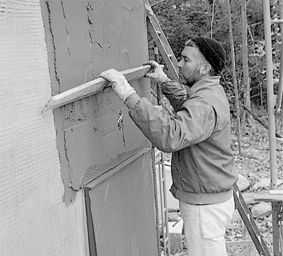 A 1/4- to 3/8-in.-thick brown coat is applied over the scratch coat and "rodded" with a straightedge.