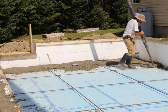 With the slab, I went around the edge and placed a foot-wide ledge of concrete before filling in the rest.