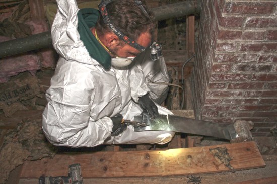 Fitting the metal to the irregular masonry was challenging.