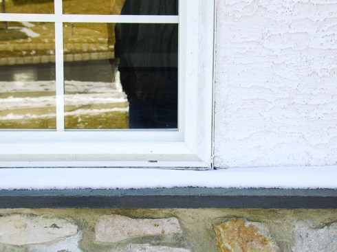 If stucco is brought tight to window and doors, it tends to crack over time as the window  and trim expands and contracts, opening an entry point for water. Photo: Dave Haines