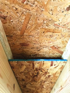 The 1 1/2-inch vent channel terminates in the vented attic of the building.